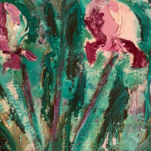 May include: Close-up of an oil painting featuring pink and purple flowers with green leaves. The painting has a textured, brushstroke effect.