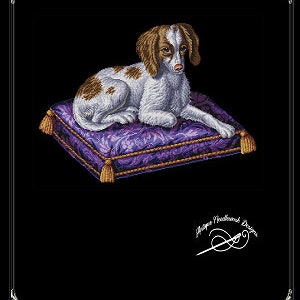 May include: A white and brown dog with brown spots lies on a purple and gold cushion. The cushion has a floral pattern and gold tassels. The dog is looking to the right. The image is titled "Berlin Woodwork Dog".