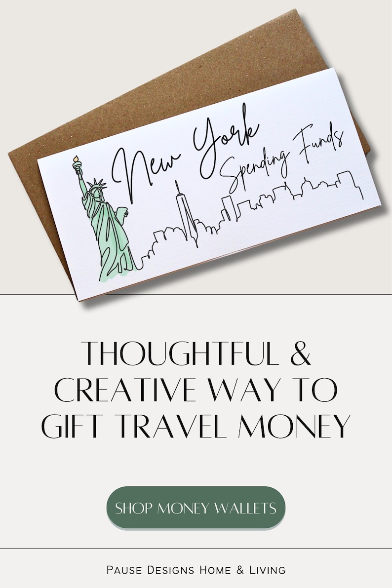 May include: A white card with the text "New York Spending Funds" and a line drawing of the Statue of Liberty and the New York City skyline. The card is on a brown envelope.