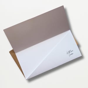 a close up of an envelope on a white surface