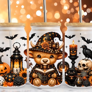 May include: Three frosted glass tumblers with bamboo lids and metal straws. The designs feature Halloween motifs including a jack-o'-lantern, a black lantern, bats, a bear wearing a witch hat reading a book, a black cat, a skull, and a raven.