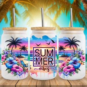 May include: Three glass tumblers with bamboo lids and metal straws. Each tumbler features a vibrant beach scene with palm trees, flowers, and the text "SUMMER vibes". The design includes a sunset, ocean, and a beach chair.