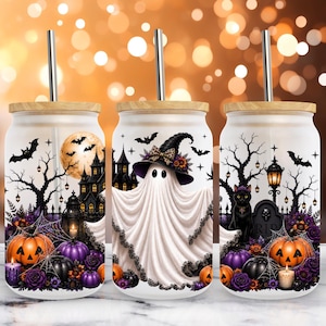 May include: Three glass tumblers with bamboo lids and metal straws, featuring a Halloween-themed wrap design. The graphics include a white ghost in a witch hat, a black cat, pumpkins, a haunted house, bats, bare trees, and purple flowers.