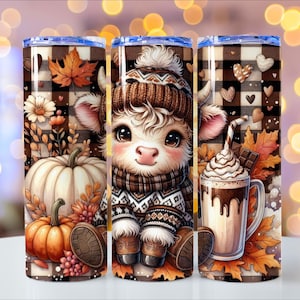 May include: Three stainless steel insulated tumblers with fall-themed designs. One features a cute cow in a winter hat and sweater. The other two have pumpkins, leaves, and a hot chocolate with whipped cream. The tumblers have a brown and white checkered pattern.