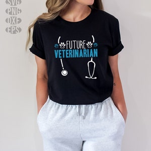 May include: Black t-shirt with the text "FUTURE VETERINARIAN" in white and teal, along with paw prints and a stethoscope graphic. The shirt is worn by a person wearing gray sweatpants.
