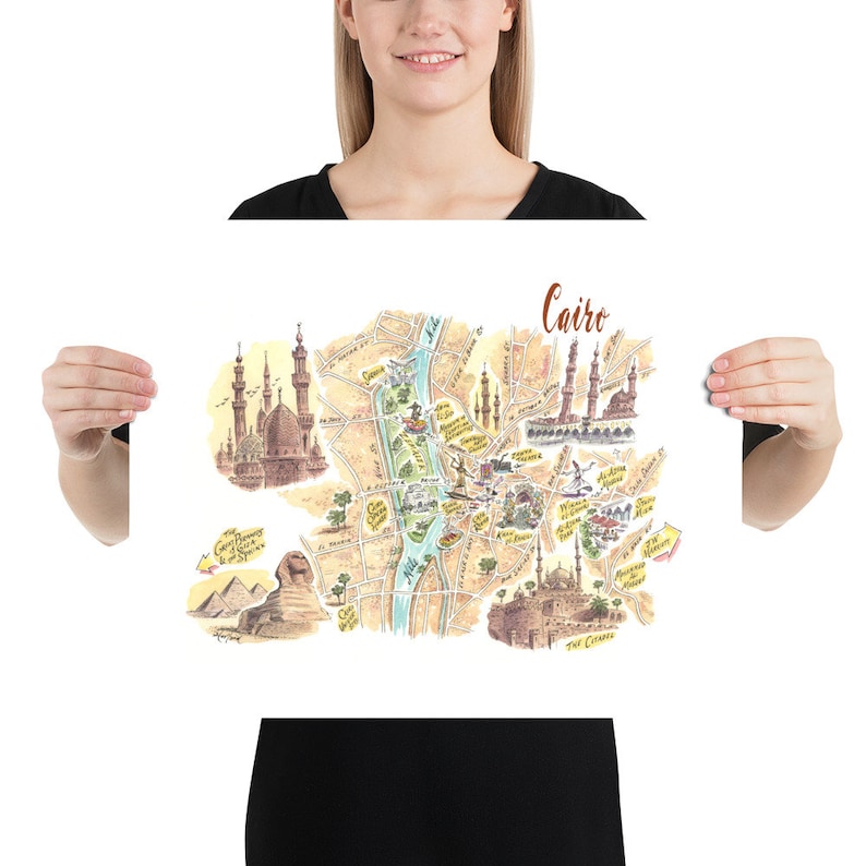 May include: A colorful illustrated map of Cairo, Egypt, with landmarks like the Great Pyramids, the Sphinx, and the Citadel of Cairo. The map is drawn in a whimsical style with a light brown background and blue river.