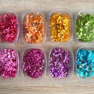 May include: A set of three ceramic mugs with a speckled, matte finish in cream, light grey, and dark grey. Each mug has a simple, minimalist design and a rounded handle.