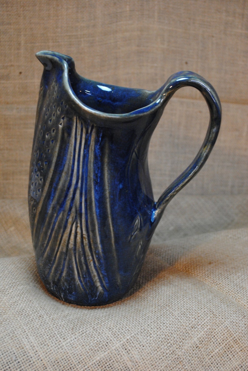 Wheel-thrown and Hand-altered Ceramic Clay Water Pitcher image 0