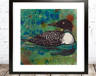 May include: A framed print of a black and white loon with a red eye, swimming in a turquoise and green water with a patterned background.