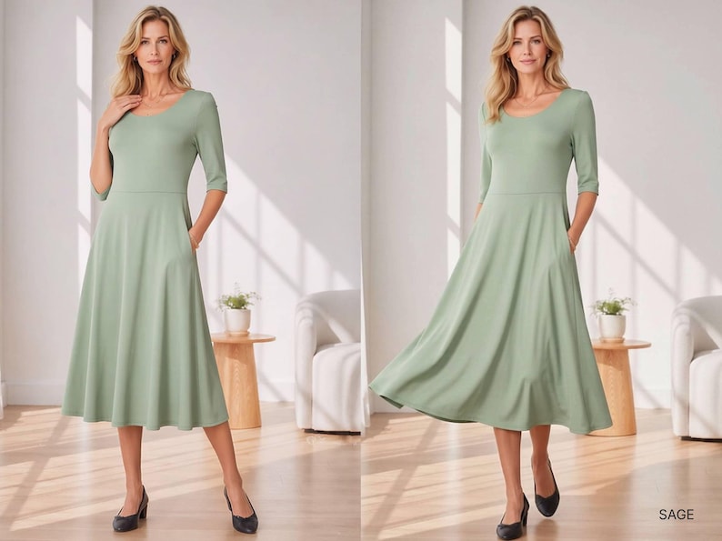 Op de afbeelding: Saliegroene midi-jurk met een ronde hals en driekwartmouwen. De jurk heeft een getailleerd lijfje, een gedefinieerde taille en een uitlopende rok met zakken. De zoom valt onder de knie&euml;n. Het woord "SAGE" staat rechtsonder gedrukt.
