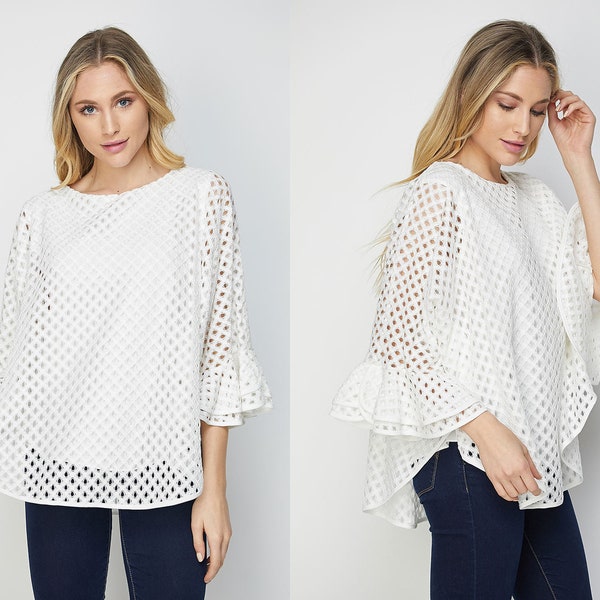 Eyelet poncho with ruffle sleeve. Double layer