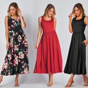 May include: Three sleeveless maxi dresses. One is black with a floral pattern of pink, white, and green. The second is solid red. The third is solid black. All have a scoop neckline and pockets.