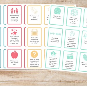 May include: A set of 20 colorful conversation starter cards with various icons and questions. The cards are printed on white cardstock and have rounded corners. The cards are designed to help people get to know each other better.