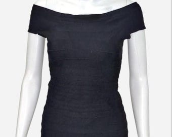 Top ajustado negro con hombros descubiertos y cremallera dorada de Herve Leger Pamela. Talla S.