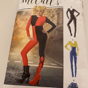 May include: McCall's sewing pattern featuring a woman in a red and black jumpsuit with diamond accents. The pattern includes illustrations of other costume options. The package has the McCall's logo in the upper left corner.