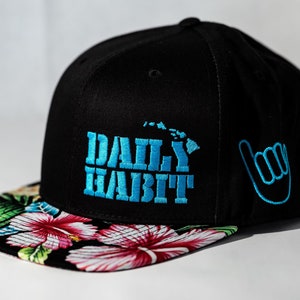 Snapback &quot;shaka&quot; hat. Aloha print bill with classic Daily Habit Island Chain and Shaka logo