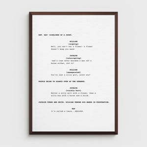 May include: A framed print displaying a script excerpt. The text is in black on a white background, with character names and dialogue. The frame is a dark brown colour.