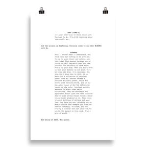 May include: A printed page with a script titled "ANDY (CONT'D)" and "MIRANDA". The text describes a conversation about fashion, including a cerulean blue sweater. The page is held by two black binder clips.