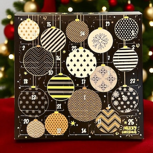 May include: A black advent calendar box with 25 numbered doors, each designed as a Christmas ornament. The ornaments feature various patterns in gold, white, and black. The box has the text "MERRY CHRISTMAS" on the bottom right.