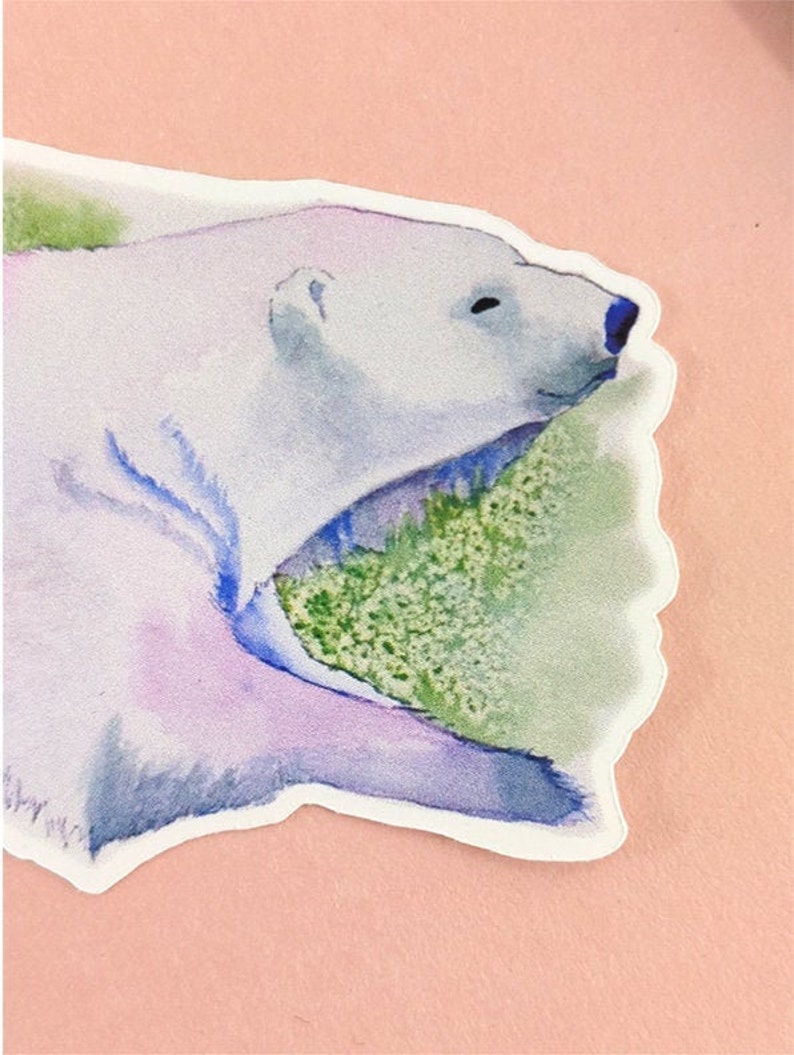 May include: A watercolor painting of a polar bear with its mouth open, appearing to be roaring. The bear is painted in shades of white, blue, and purple, with a green background.