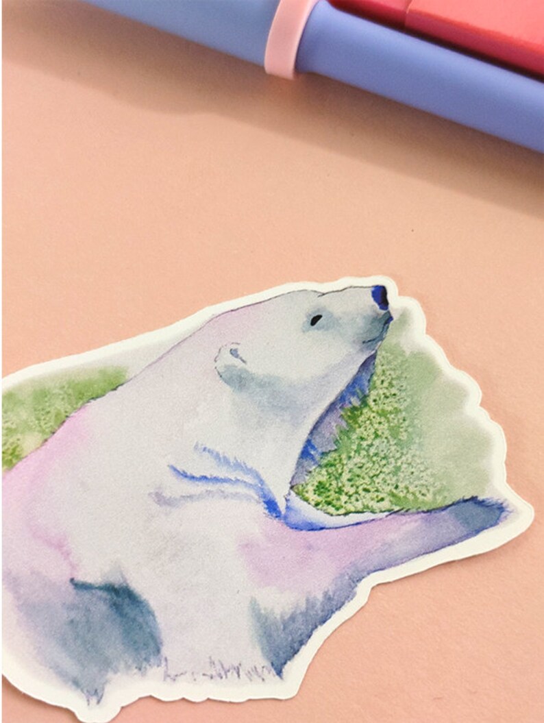 May include: A watercolor sticker of a polar bear with a light blue, purple, and green background. The bear is facing to the right and has its mouth open.