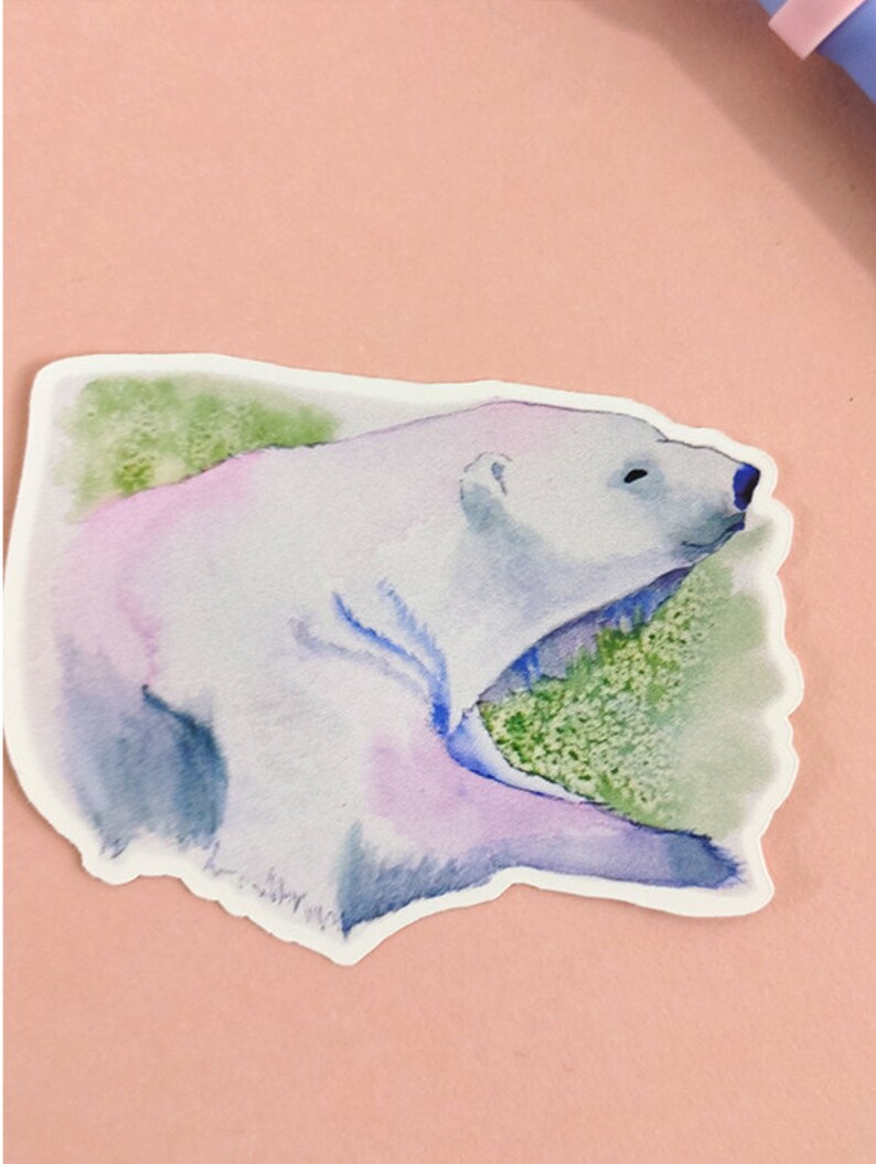 May include: A watercolor illustration of a polar bear lying down with its mouth open, surrounded by green foliage. The bear is painted in shades of white, blue, and purple.