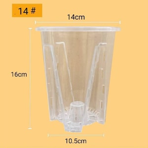 May include: A clear plastic plant pot, 14 cm wide, 16 cm tall, and 10.5 cm at the base. The pot has a flared top and a textured interior. The text "14 #" is in the upper left corner.