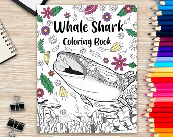 May include: A "Whale Shark Coloring Book" with a detailed illustration of a whale shark with its mouth open, surrounded by floral and aquatic elements. The cover features the title in bold black letters and is surrounded by colorful pencils.