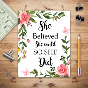 May include: A white background with a floral design and the text "She Believed She could SO SHE Did".