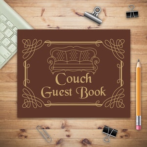 May include: A brown guest book with a gold couch design and the text "Couch Guest Book" on the front cover.