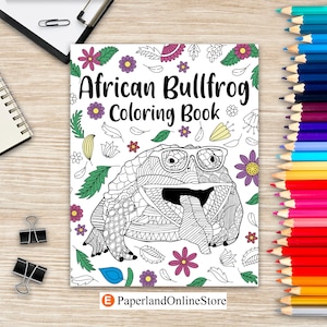 Puede incluir: Una portada de libro para colorear en blanco y negro con una ilustración de un sapo con gafas. El título del libro es "African Bullfrog Coloring Book".