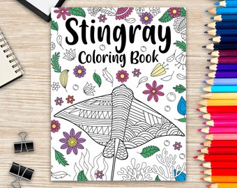 May include: A black and white coloring book cover featuring a stingray with intricate patterns. The title "Stingray Coloring Book" is written in bold black letters with flowers and leaves surrounding the stingray.