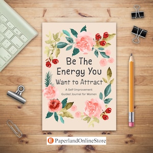 May include: A pink and green floral design journal cover with the text "Be The Energy You Want to Attract" and "A Self-Improvement Guided Journal for Women".