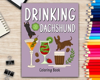 May include: A purple coloring book cover with the text "Drinking Dachshund" in white. The cover features illustrations of a dachshund drinking a martini, a dachshund drinking a green cocktail, and a dachshund drinking a glass of coffee. The cover also includes illustrations of olives, kiwi, coffee beans, and a strawberry.