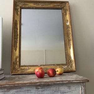 French Antique Giltwood Mirror. Empire Period 1810-1840’s. Beautiful classic proportions, superb gilding, all original parts. Most handsome