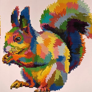 May include: A colourful mosaic-style squirrel with a bushy tail. The squirrel is depicted in shades of red, orange, yellow, green, blue, and purple.