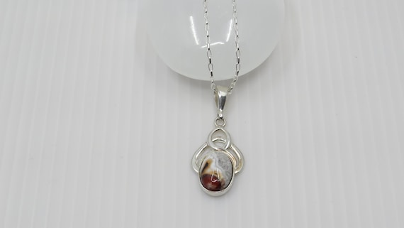 Handmade Crazy lace agate Pendant set in sterling silver