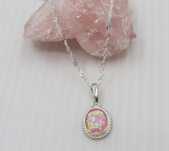 Handmade pink opal oval pendant set in sterling silver