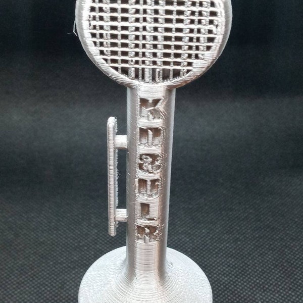 Ham Radio, a D- 104 or a Classic Microphone ornament,  with your call sign cut into the handle. The example is my call.