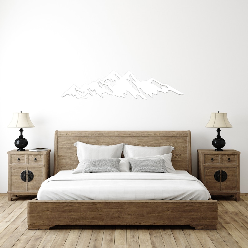 Metal Mountain Wall Art: A captivating depiction of mountain peaks crafted in durable metal, perfect for adding natural charm to any room.