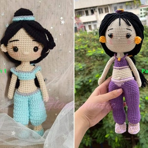 May include: Two crochet dolls, each depicting a character with black hair and a costume. One doll wears a light blue outfit, and the other wears a purple outfit. The dolls are handmade and have a cartoonish appearance. The text "Pattern 1" and "Pattern 2" are visible.