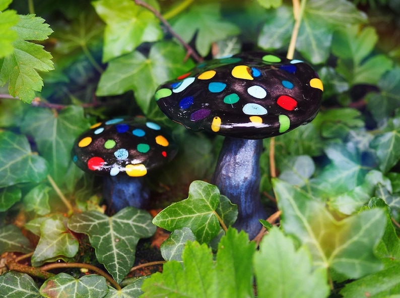 Black ceramic mushrooms with colored polka dots Black ceramic mushrooms with colored polka dots