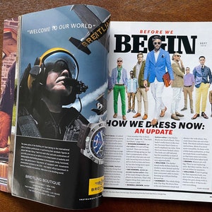 May include: A magazine spread featuring a group of men in various styles of clothing, with the headline "How We Dress Now: An Update". The text discusses current fashion trends and includes a quote from "The Way We Dress Now" by Wendell Brown.