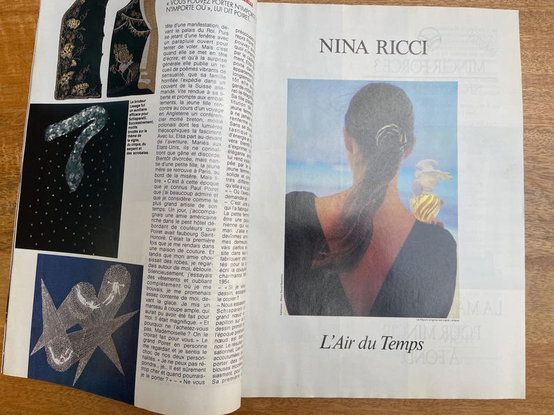 May include: A magazine spread featuring fashion and perfume advertisements. One ad showcases a woman with her back to the viewer, with a perfume bottle on her shoulder. The text "NINA RICCI" and "L'Air du Temps" are visible.