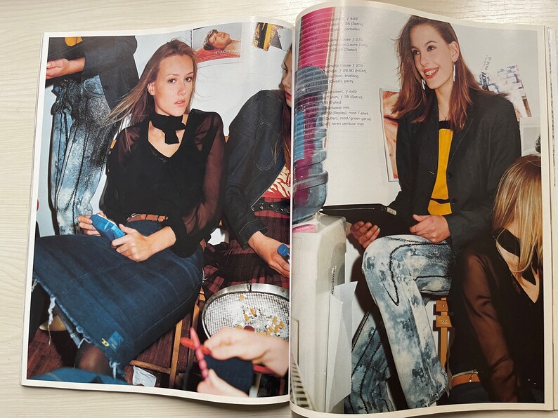 May include: Three women wearing different styles of clothing. One woman is wearing a black top with a white collar and a denim skirt. Another woman is wearing a black blazer with a yellow top and denim jeans. The third woman is wearing a black top with a denim skirt.