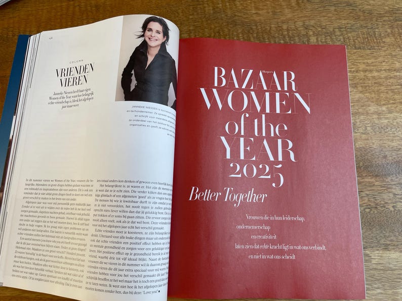 May include: A magazine spread featuring a woman's portrait and text. The right page has a red background with the text "BAZAAR WOMEN of the YEAR 2025 Better Together". The left page has text in a different language.