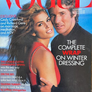 May include: A November issue of Vogue magazine featuring Cindy Crawford and Richard Gere on the cover. The cover displays the text VOGUE, EXCLUSIVE Cindy Crawford and Richard Gere on marriage, meditation, and MTV, and THE COMPLETE WRAP ON WINTER DRESSING.
