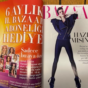 May include: A magazine cover featuring a woman wearing a blue denim jacket and black leggings. The magazine is titled "Harper's Bazaar" and the text "6 AYLIK H. BAZAAR ABONELİGİ HEDİYE" is in large font on the cover.