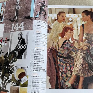 May include: A magazine spread featuring fashion and beauty content. The pages display images of models, makeup, and fashion editorials. Numbers and text are visible, including "ELLE" and "144".