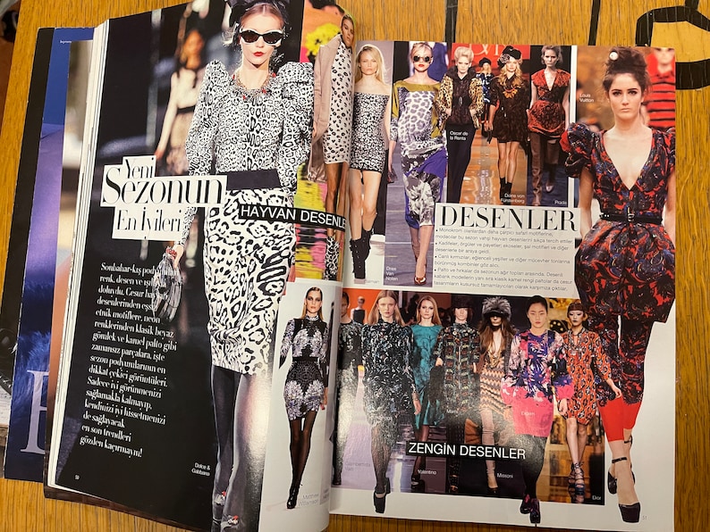 May include: A magazine spread showcasing fashion models wearing clothing with animal print and geometric patterns. The text on the page reads "Yeni Sezonun En İvileri" and "HAYVAN DESENLER" in Turkish. The text also reads "DESENLER" and "ZENGİN DESENLER" in Turkish.
